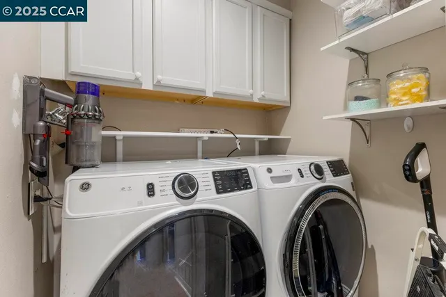 a bedroom with furniture and a large window