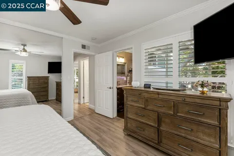 a kitchen with stainless steel appliances granite countertop a refrigerator and a table