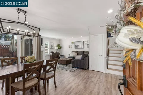 a view of a livingroom with furniture and hardwood floor