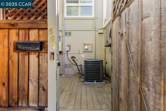 a view of a brick building with a bench in front of building