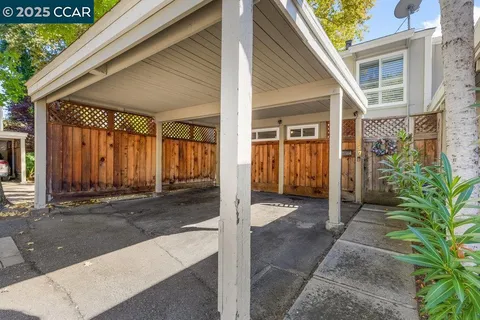 an aerial view of residential house and car parked