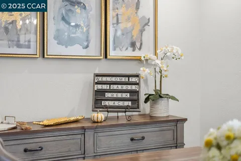 a view of mirror and cabinets