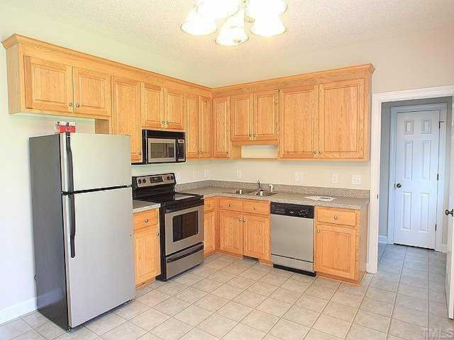 1900 Johnston County Road Benson, NC 27504 - Photo 4 of 9 Gorgeous Kitchen features SS Appliances and Wood Cabinets. Kitchen