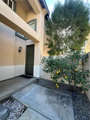 a view of a house with a tree