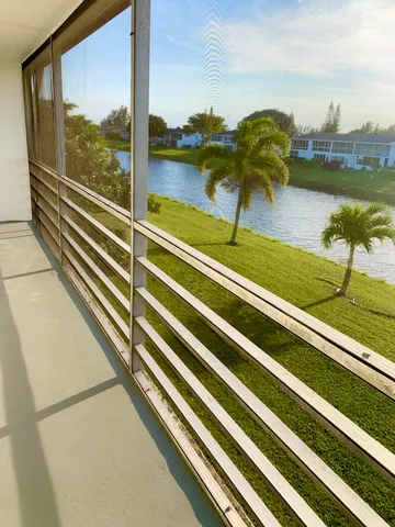 a view of swimming pool from a balcony