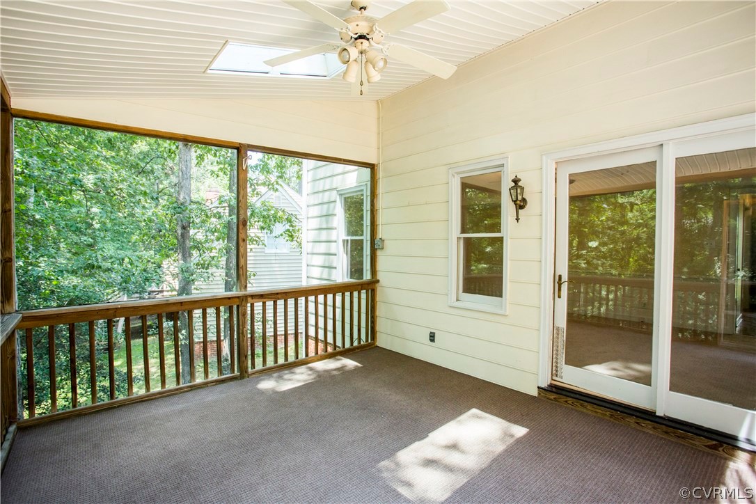 5111 Rock Harbour Road Midlothian, VA 23112 - Photo 16 of 50 a view of a porch with a ceiling fan and a backyard