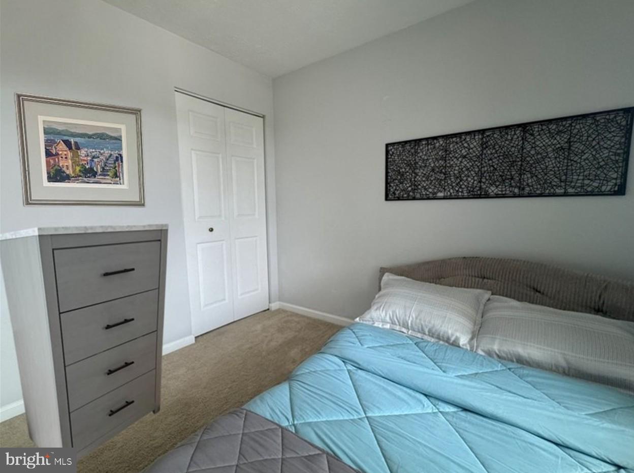 1601 Berry Rose Court, Unit 4 3J Frederick, MD 21701 - Photo 11 of 17 a bedroom with a bed and cabinet