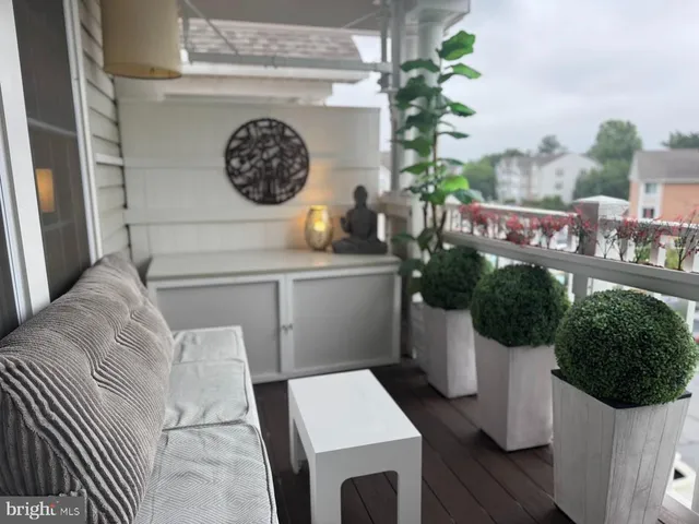 a living room with furniture and a clock