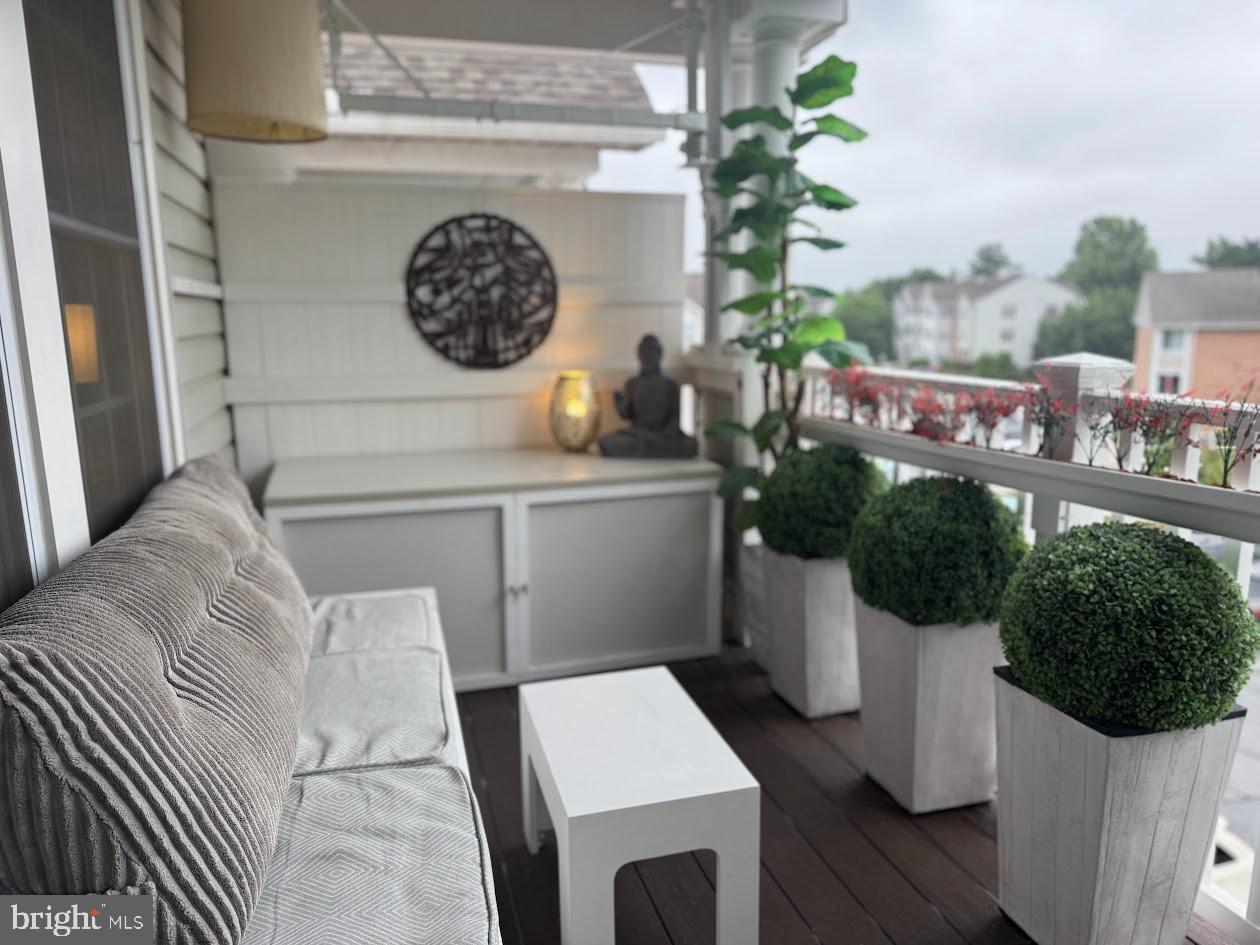 1601 Berry Rose Court, Unit 4 3J Frederick, MD 21701 - Photo 6 of 17 a living room with furniture and a clock