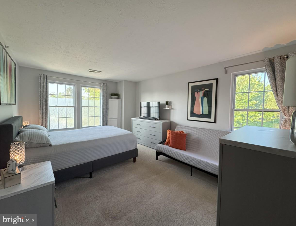 1601 Berry Rose Court, Unit 4 3J Frederick, MD 21701 - Photo 7 of 17 a bedroom with furniture and a window