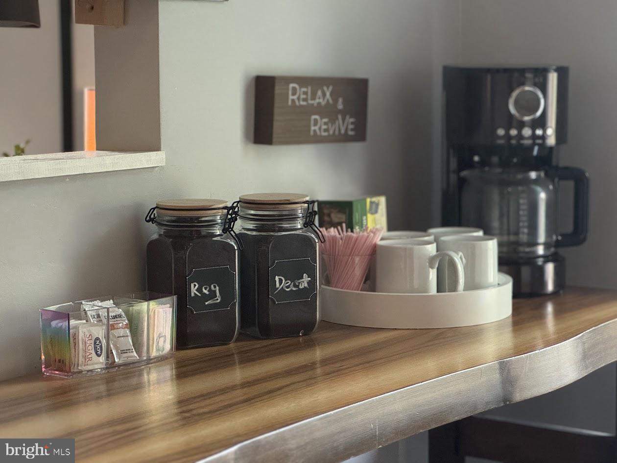 1601 Berry Rose Court, Unit 4 3J Frederick, MD 21701 - Photo 9 of 17 a kitchen with a stove and a wooden floor