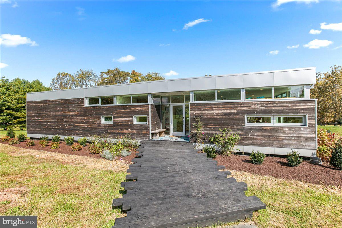 10222 Van Thompson Road Fairfax Station, VA 22039 - Photo 1 of 37 a view of a porch with a bench