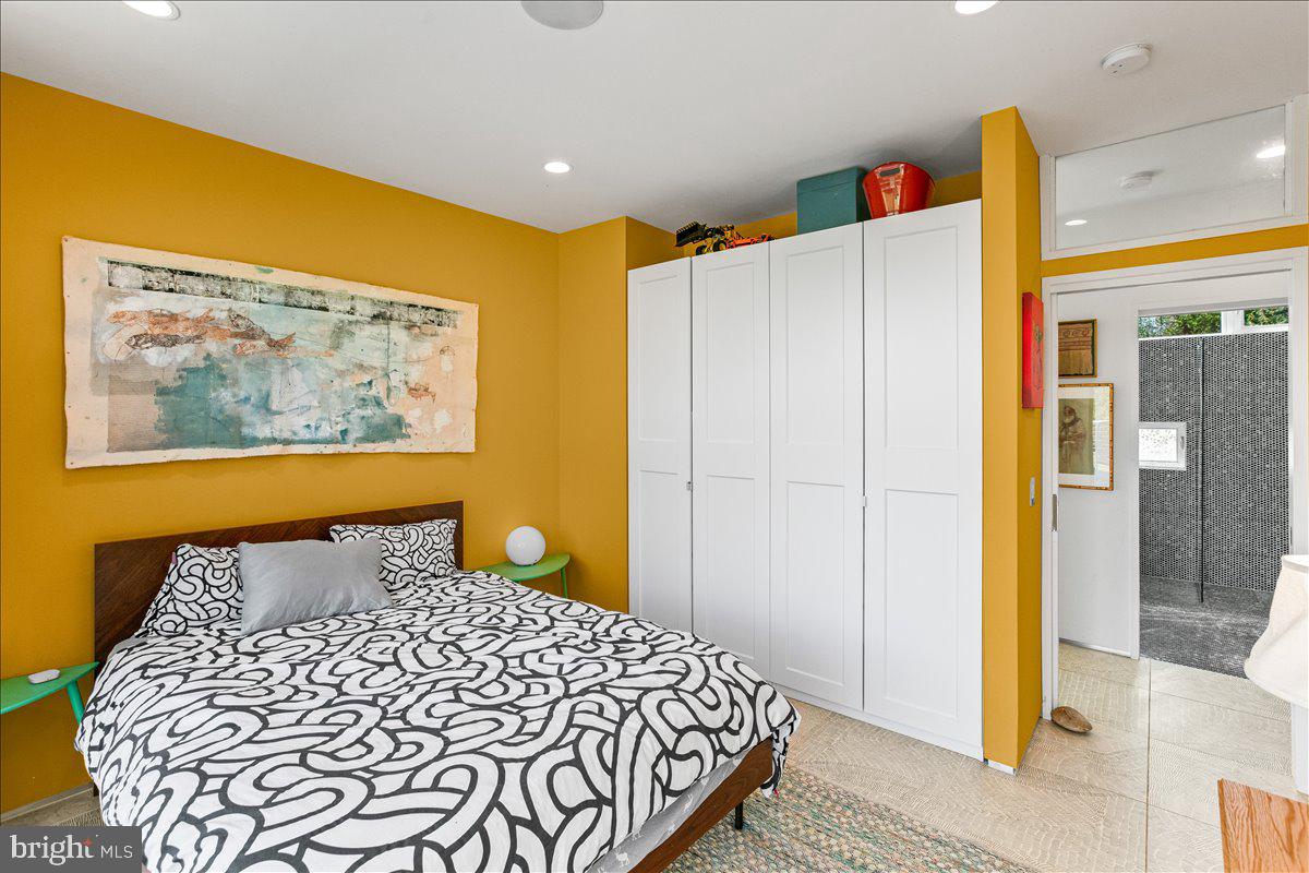 10222 Van Thompson Road Fairfax Station, VA 22039 - Photo 14 of 37 a bedroom with a bed and wooden floor