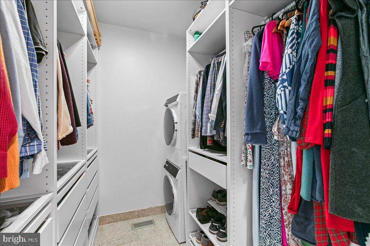 10222 Van Thompson Road Fairfax Station, VA 22039 - Photo 18 of 37 a view of walk in closet with clothes and shoes