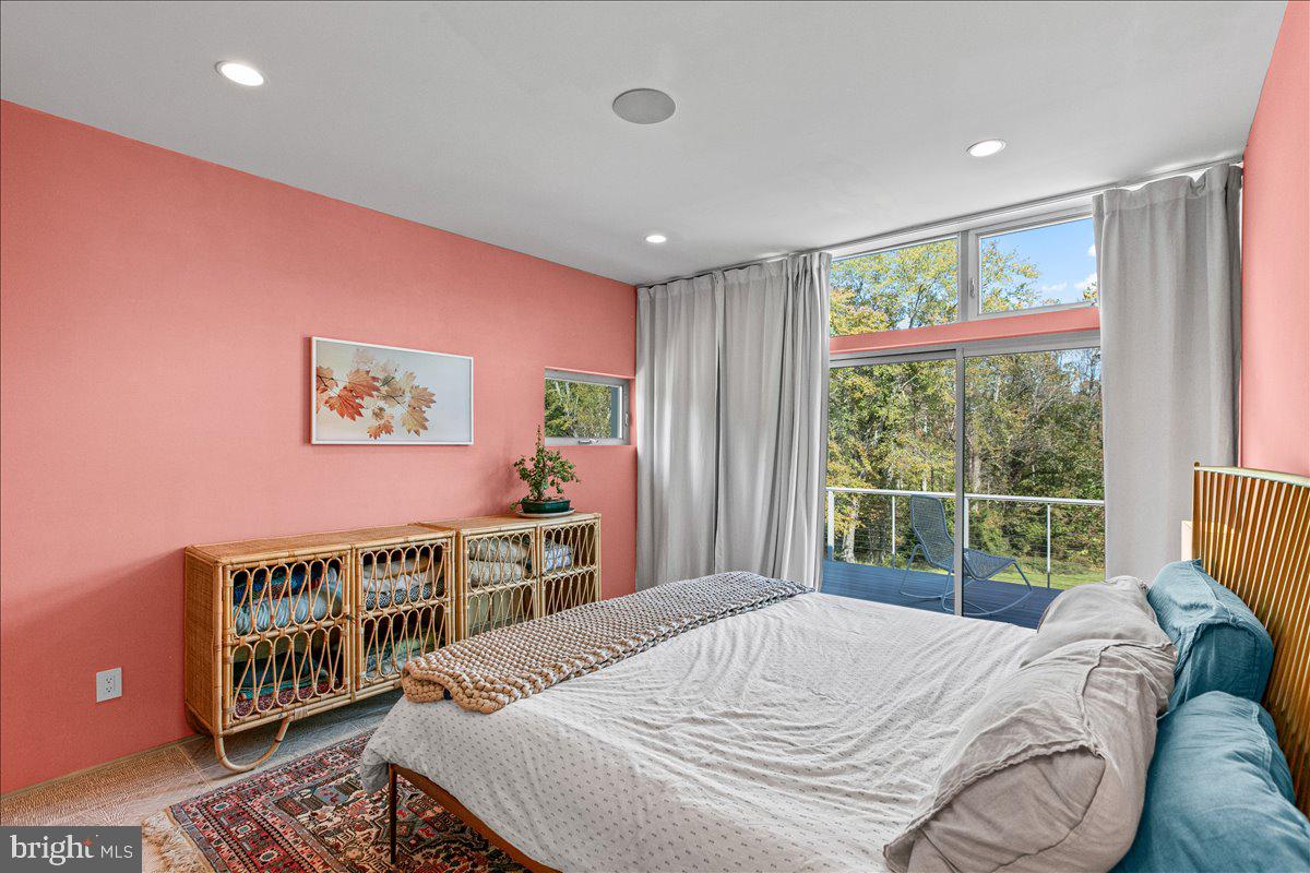 10222 Van Thompson Road Fairfax Station, VA 22039 - Photo 19 of 37 a bedroom with a bed and a large window