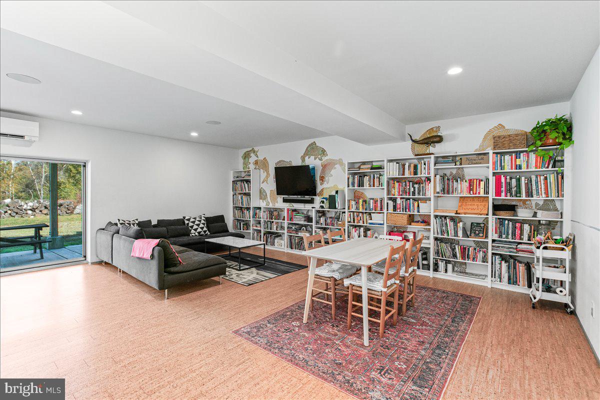 10222 Van Thompson Road Fairfax Station, VA 22039 - Photo 24 of 37 a living room with lots of furniture and a flat screen tv