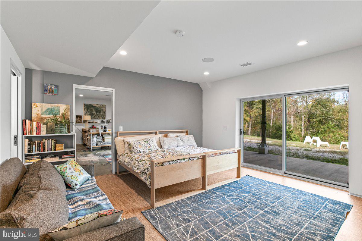 10222 Van Thompson Road Fairfax Station, VA 22039 - Photo 27 of 37 a bedroom with double bed and a large window