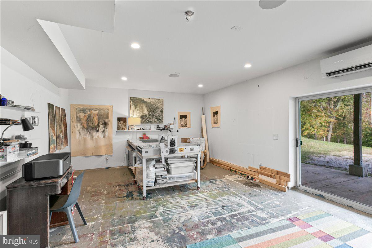 10222 Van Thompson Road Fairfax Station, VA 22039 - Photo 28 of 37 a view of a livingroom with furniture and a rug