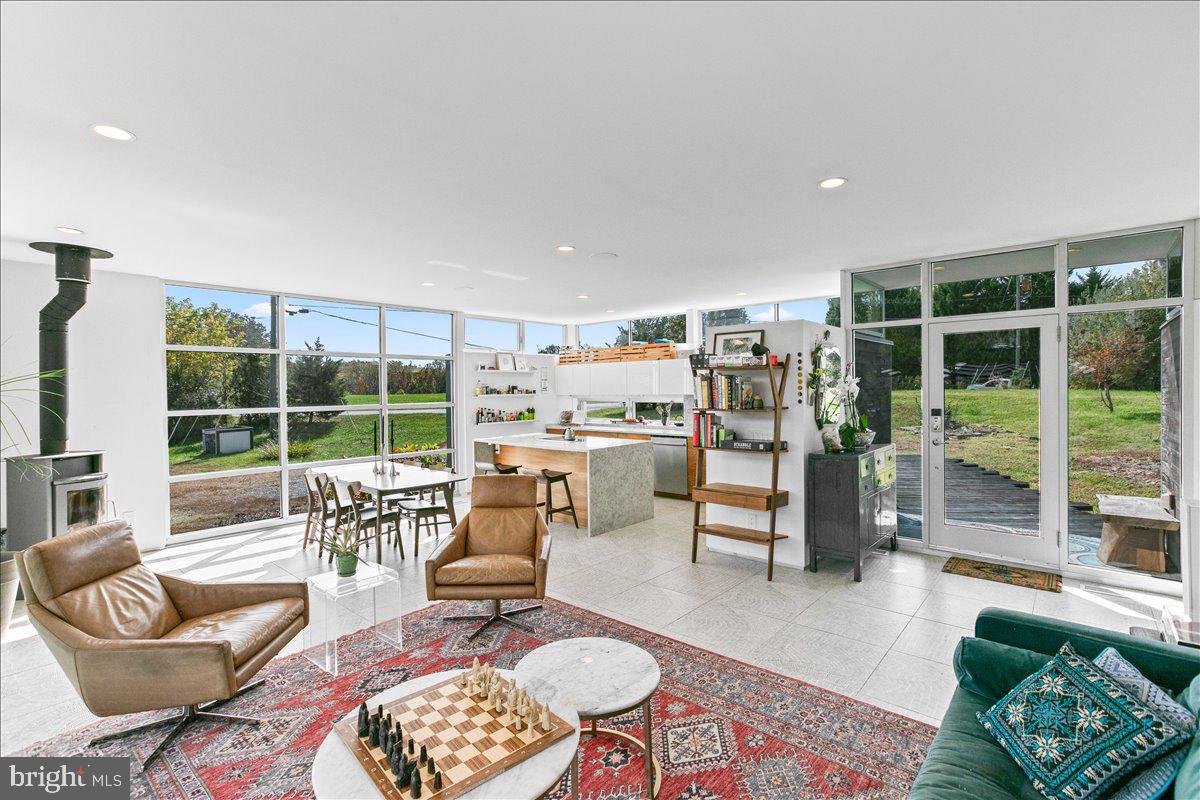 10222 Van Thompson Road Fairfax Station, VA 22039 - Photo 3 of 37 a living room with furniture and a large window