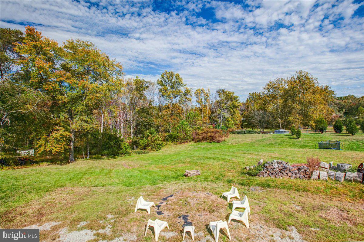 10222 Van Thompson Road Fairfax Station, VA 22039 - Photo 31 of 37 a view of a golf course with a big yard