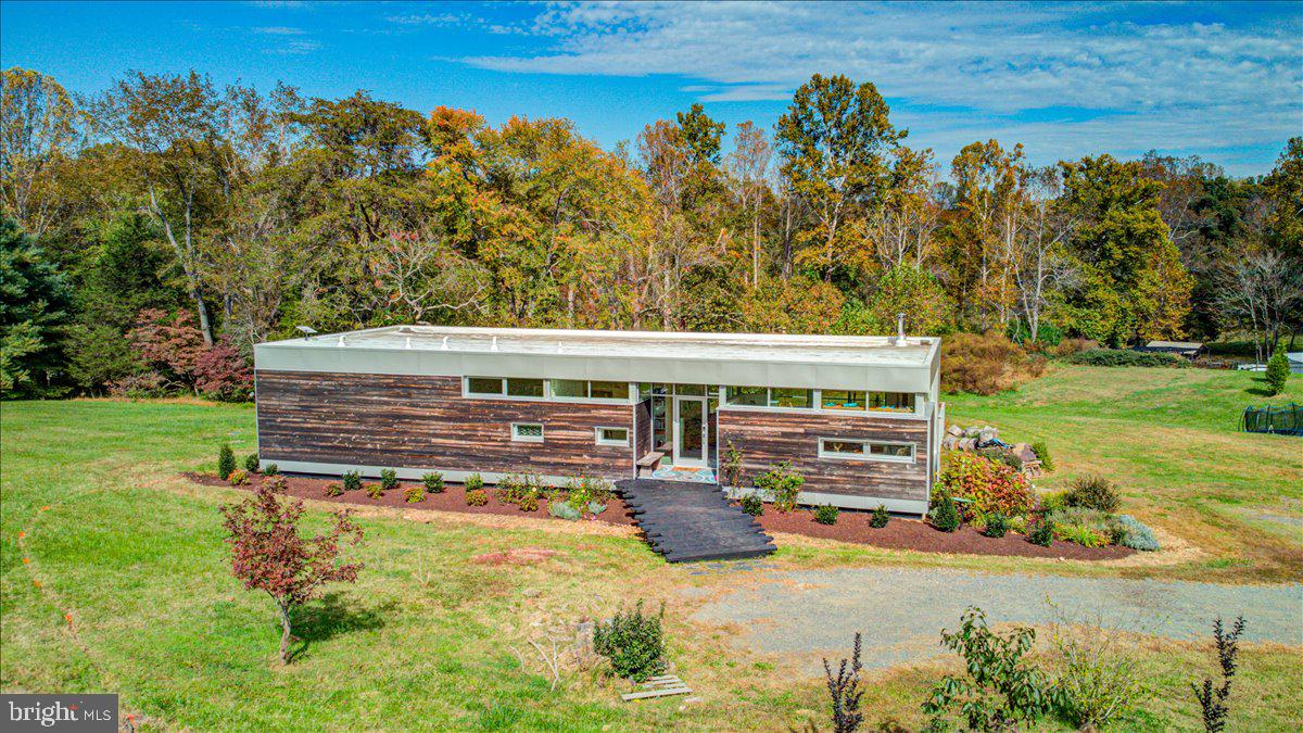 10222 Van Thompson Road Fairfax Station, VA 22039 - Photo 35 of 37 a view of a house with pool and a yard