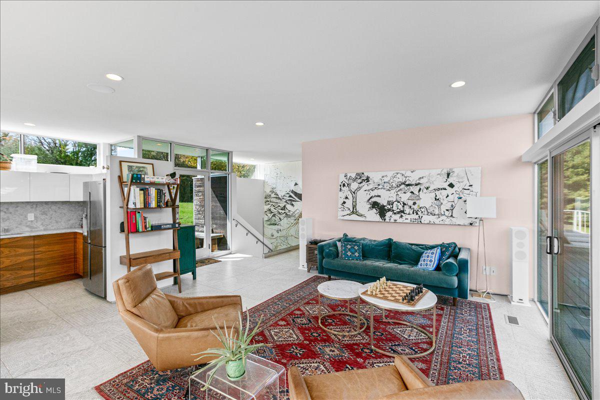 10222 Van Thompson Road Fairfax Station, VA 22039 - Photo 4 of 37 a living room with furniture and white walls
