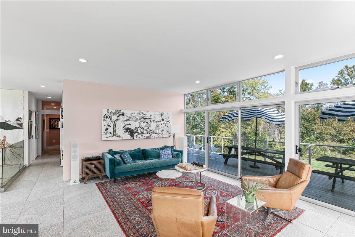 10222 Van Thompson Road Fairfax Station, VA 22039 - Photo 5 of 37 a living room with furniture and a large window