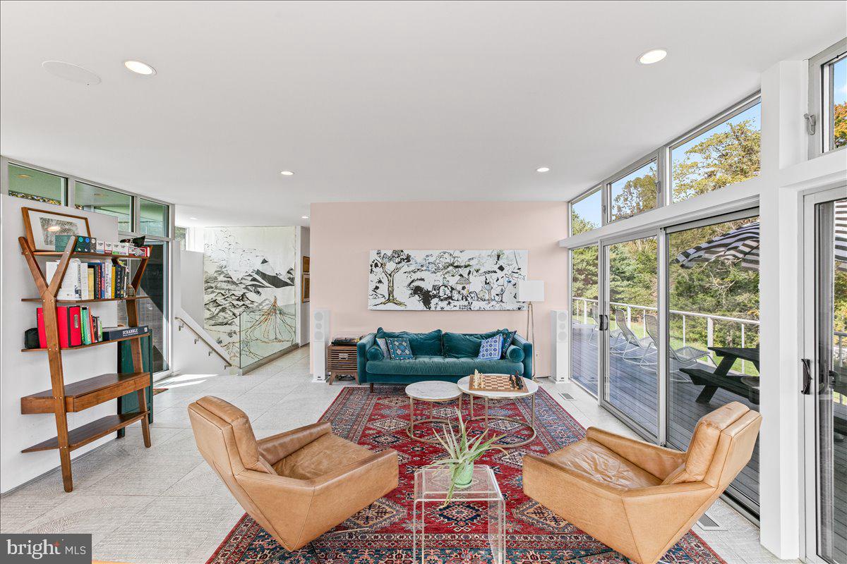 10222 Van Thompson Road Fairfax Station, VA 22039 - Photo 6 of 37 a living room with furniture and a floor to ceiling window