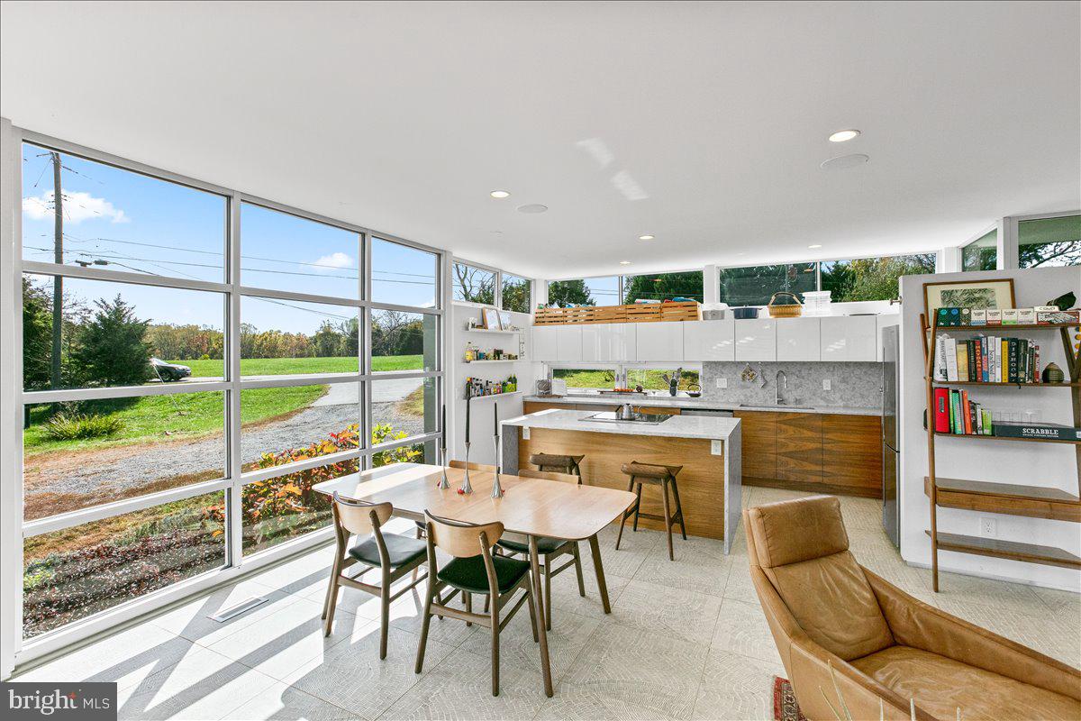 10222 Van Thompson Road Fairfax Station, VA 22039 - Photo 7 of 37 a view of a dining room with furniture window and outside view