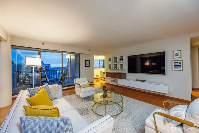 a living room with furniture and a flat screen tv