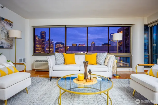 a living room with furniture and a large window