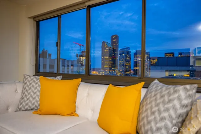 a swimming pool with outdoor seating and yard