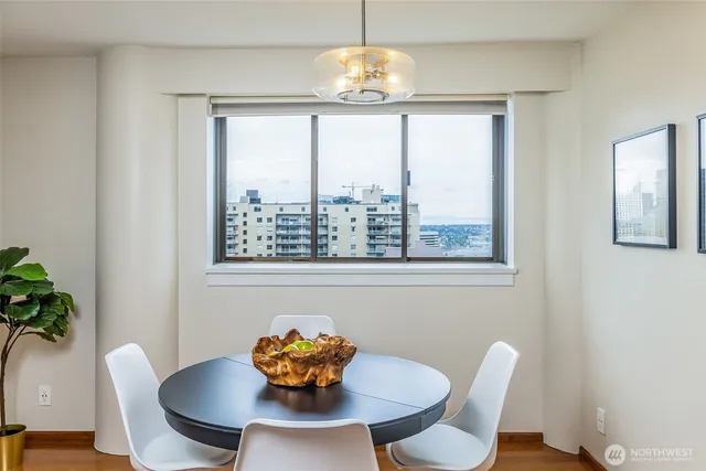 a view of a dining room with furniture window and wooden floor