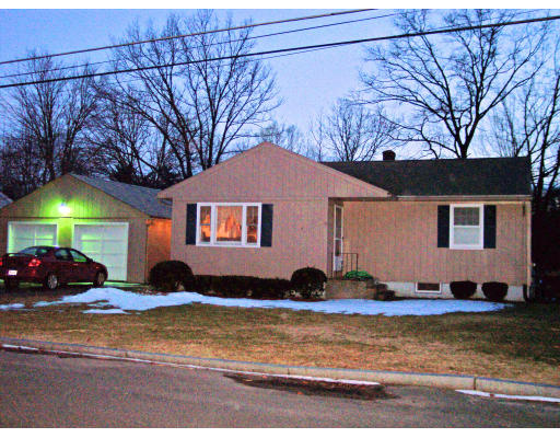 183 Garvey Drive Springfield, MA 01109 - Photo 1 of 14 a front view of a house with a yard
