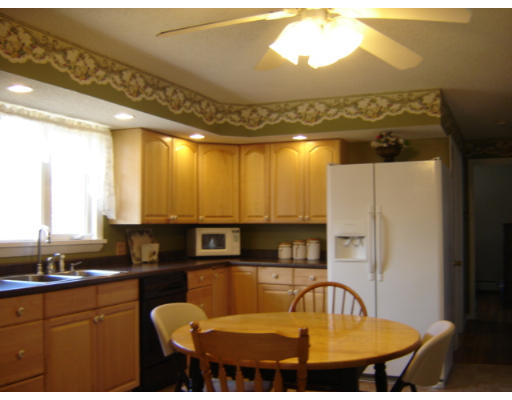 183 Garvey Drive Springfield, MA 01109 - Photo 3 of 14 a kitchen with a sink refrigerator and stove