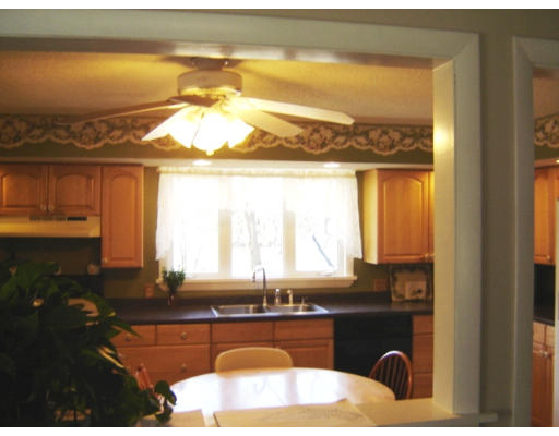 183 Garvey Drive Springfield, MA 01109 - Photo 5 of 14 a kitchen with a window a sink and a dining table