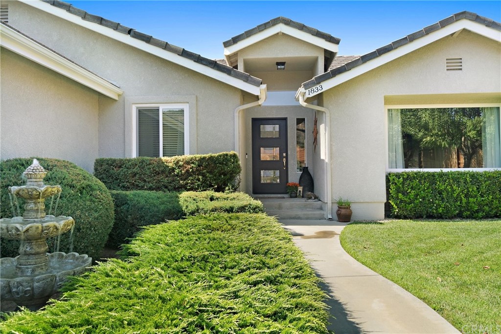 1833 Southfork Place Paso Robles, CA 93446 - Photo 3 of 35 a front view of a house with garden