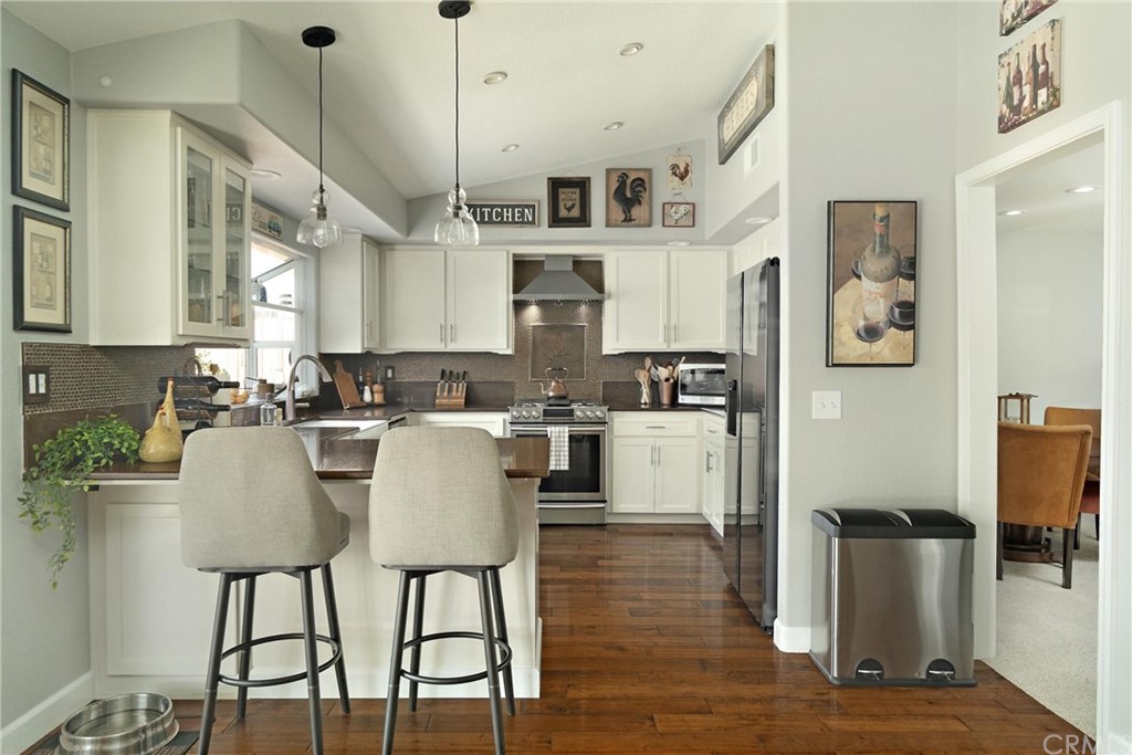 1833 Southfork Place Paso Robles, CA 93446 - Photo 8 of 35 a view of kitchen and dining room with wooden floor