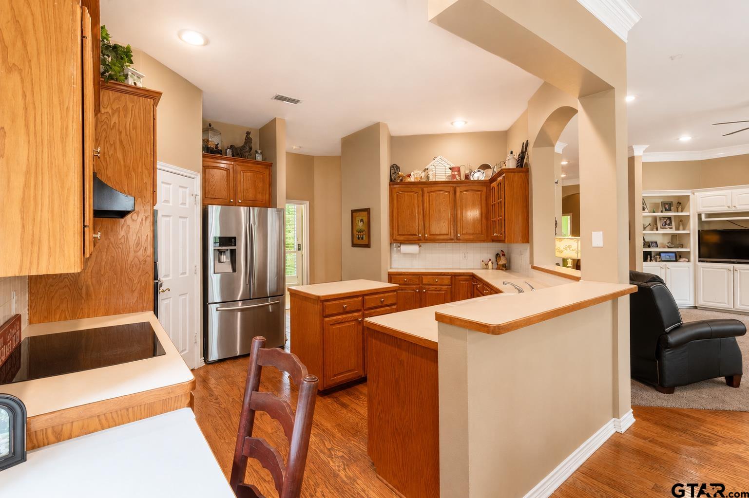 1388 Santa Fe Trail Tyler, TX 75703 - Photo 24 of 46 a kitchen with stainless steel appliances granite countertop a refrigerator and a sink