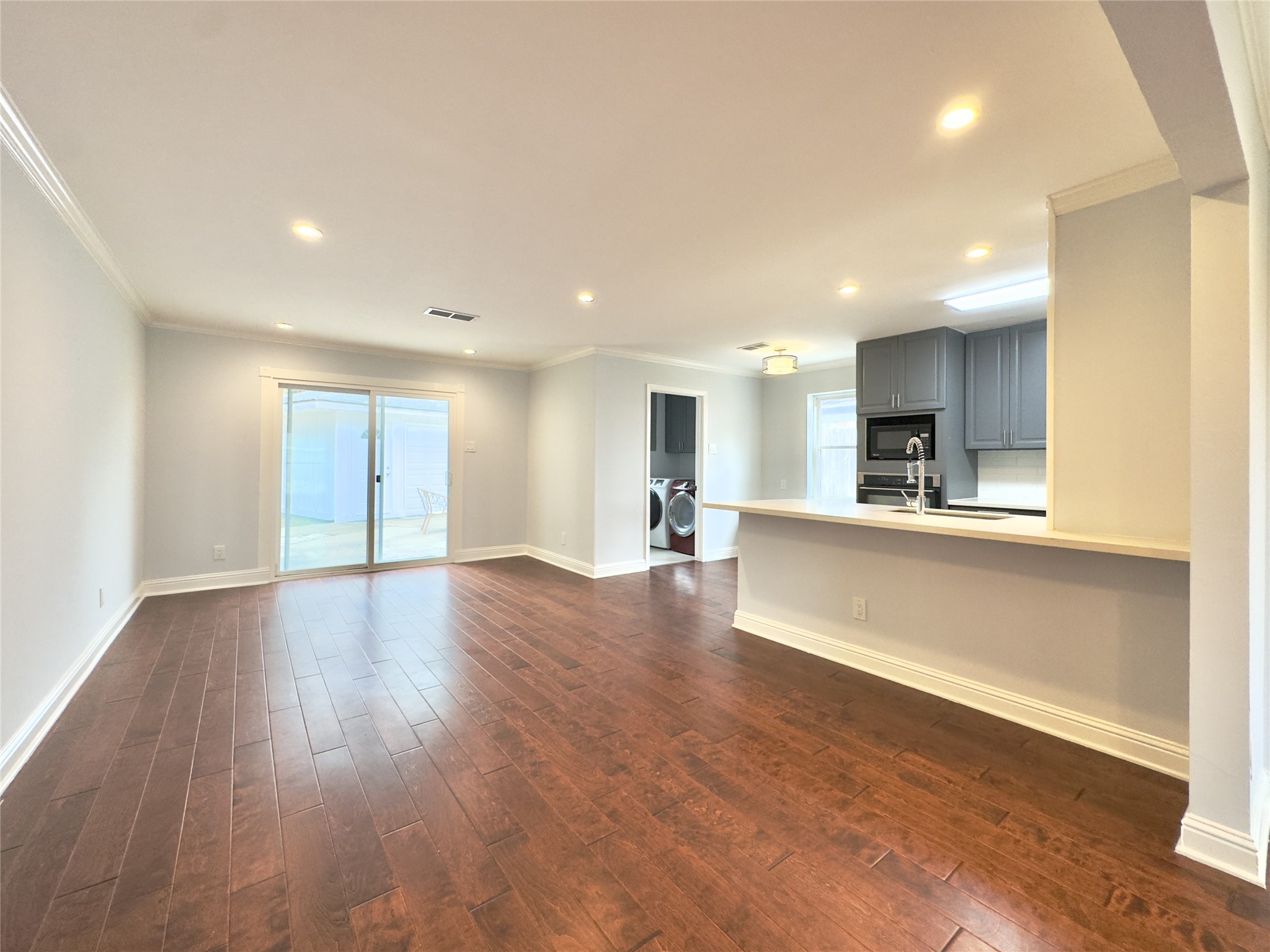 1415 Mapleton Drive Houston, TX 77043 - Photo 14 of 45 a view of kitchen with cabinets and wooden floor