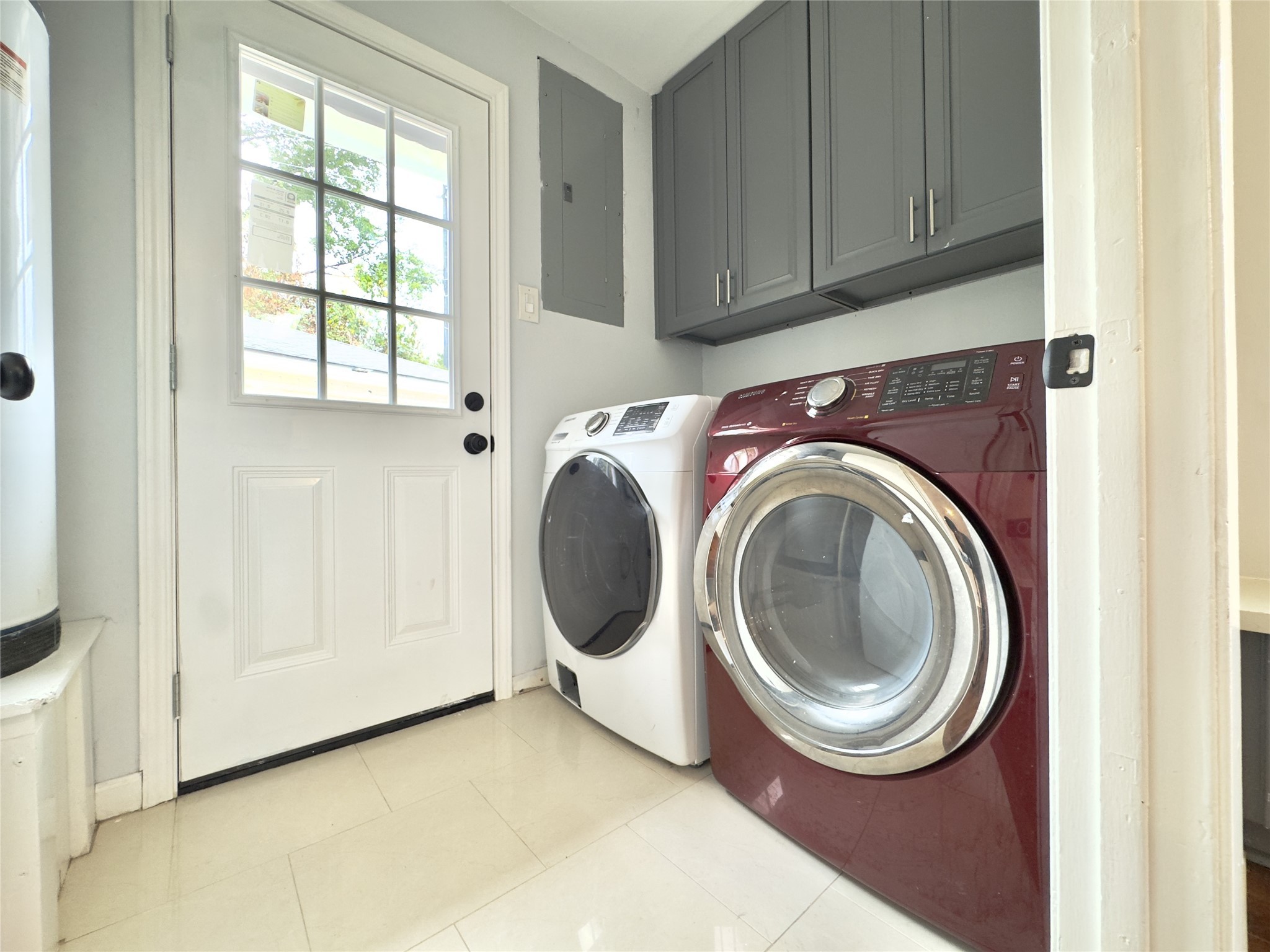 1415 Mapleton Drive Houston, TX 77043 - Photo 33 of 45 a view of a storage and utility room with washer and dryer