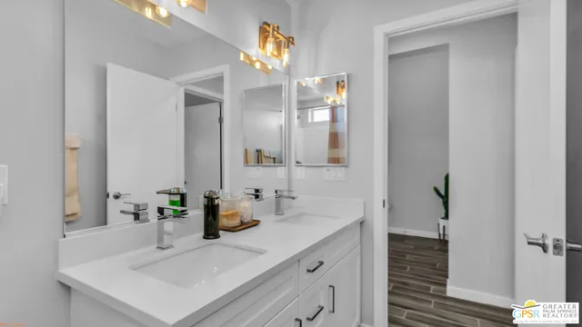 a bathroom with a sink vanity and a mirror
