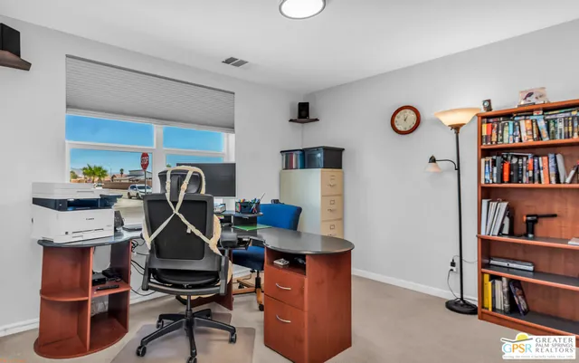 a view of a workspace with furniture