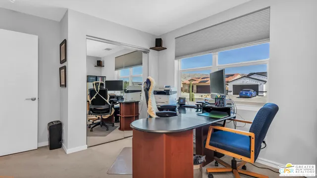 a workspace with furniture and a kitchen