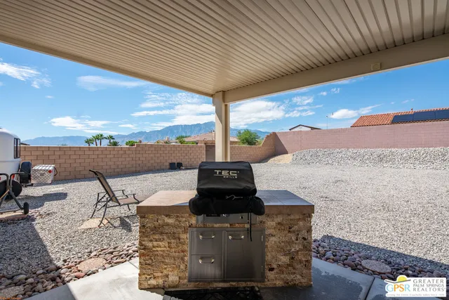 a view of a balcony with table and chairs