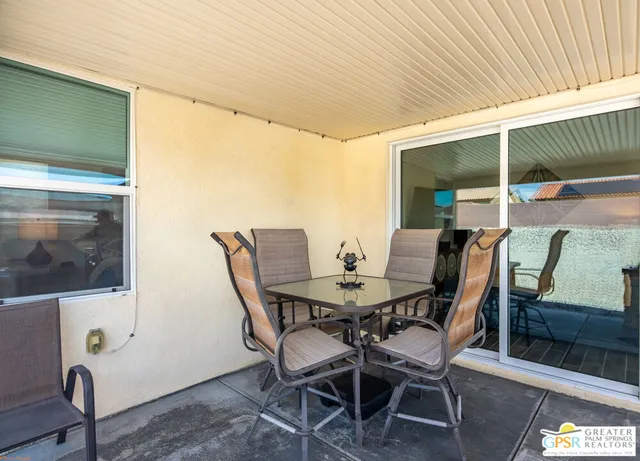 a view of an outdoor space with furniture