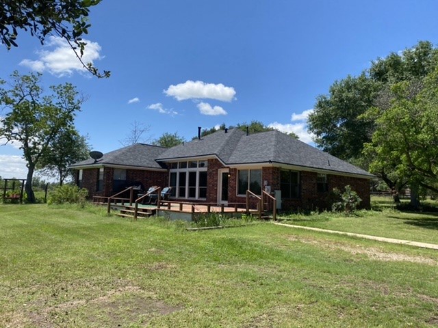 17330 Penick Road Waller, TX 77484 - Photo 2 of 10 a view of a house with a yard porch and sitting area