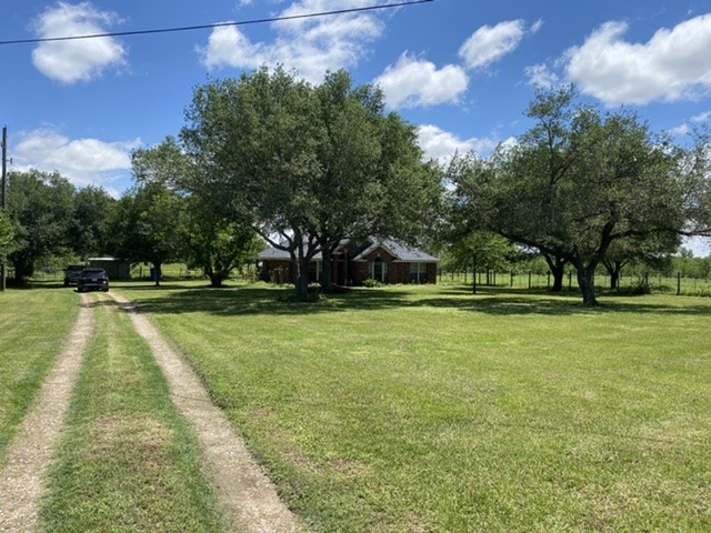 17330 Penick Road Waller, TX 77484 - Photo 4 of 10 a view of yard with swimming pool and green space