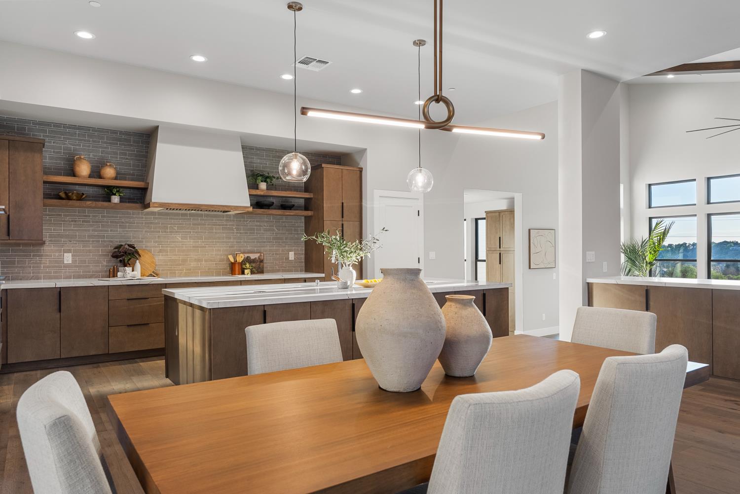 1700 Ridgeview Circle Auburn, CA 95603 - Photo 11 of 39 a kitchen with stainless steel appliances granite countertop a stove a sink a kitchen island with chairs and white cabinets