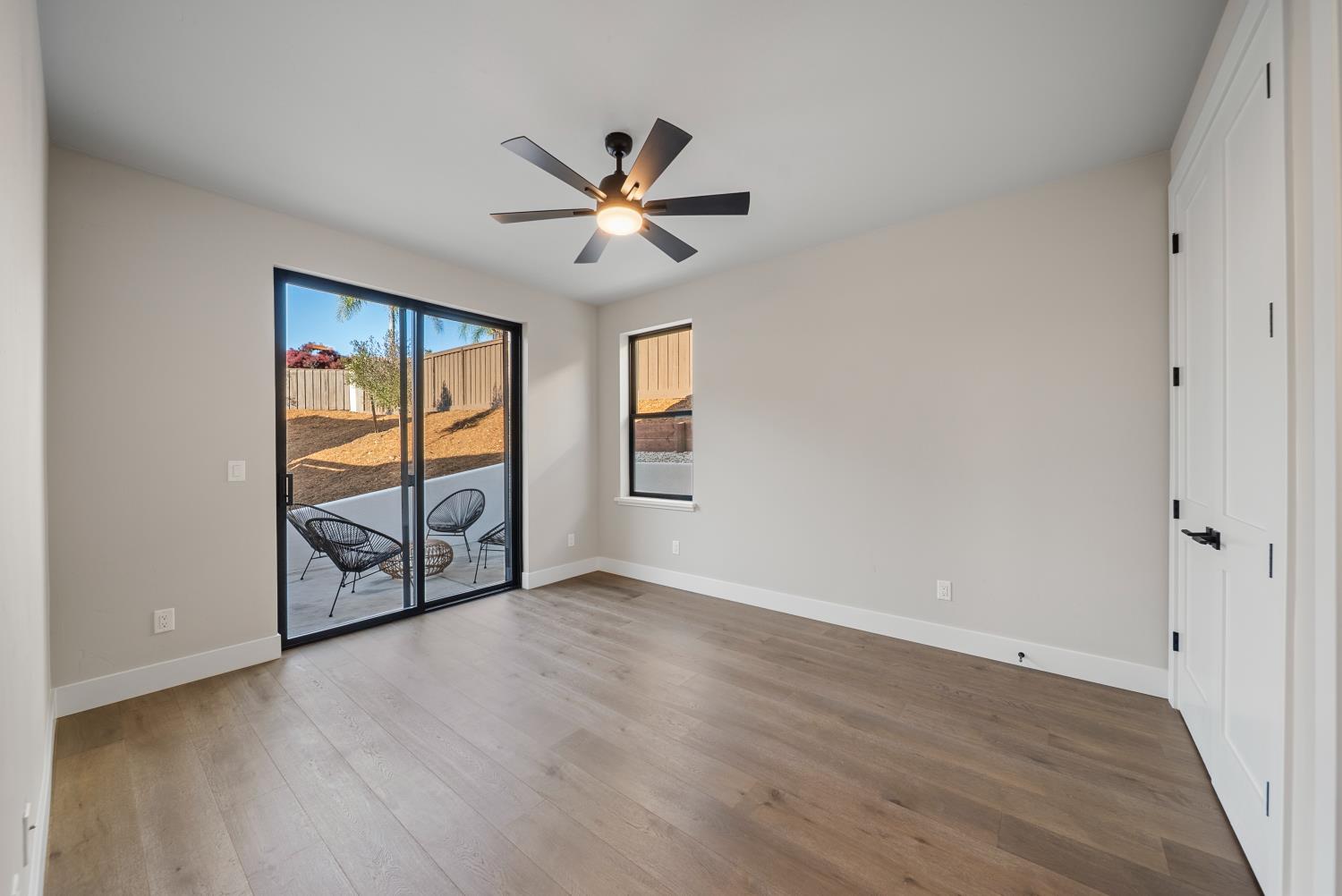 1700 Ridgeview Circle Auburn, CA 95603 - Photo 21 of 39 an empty room with wooden floor closet and windows